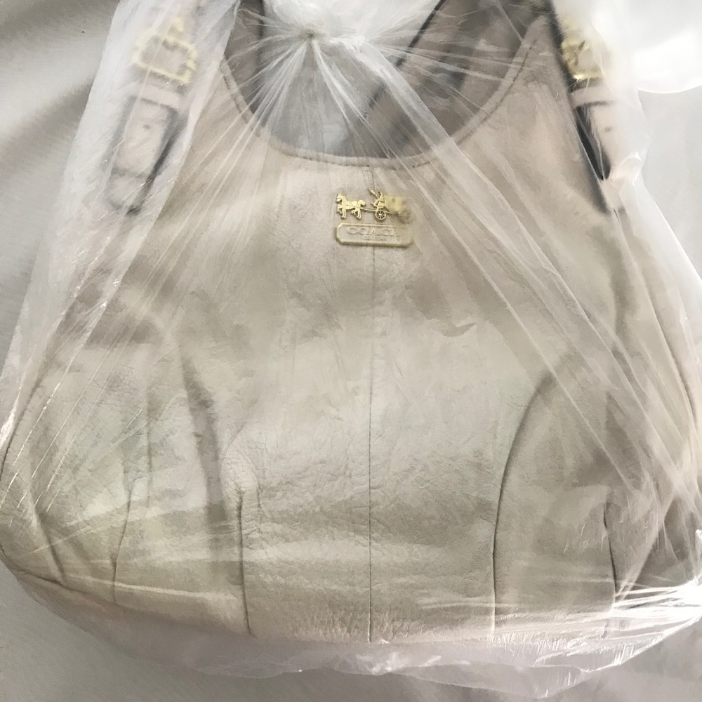 Coach bag. Ivory leather.  Free Coach leather cleaner.
